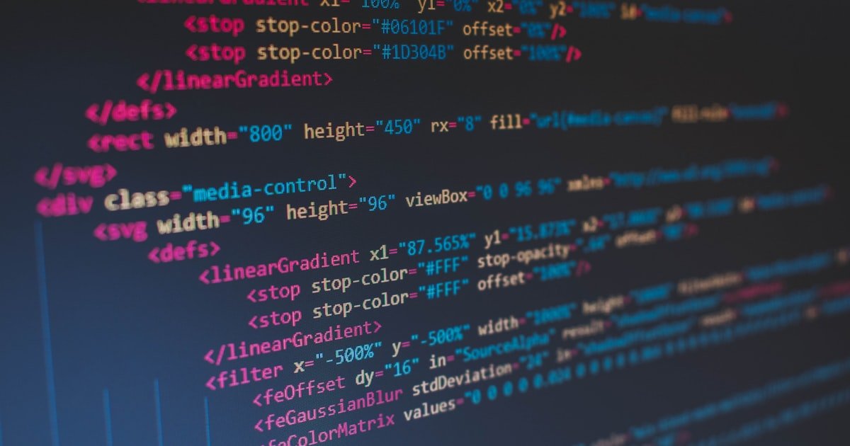 Close-up of colorful lines of code on a dark screen